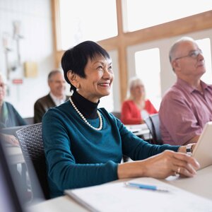 smiling mature woman in a classroom setting